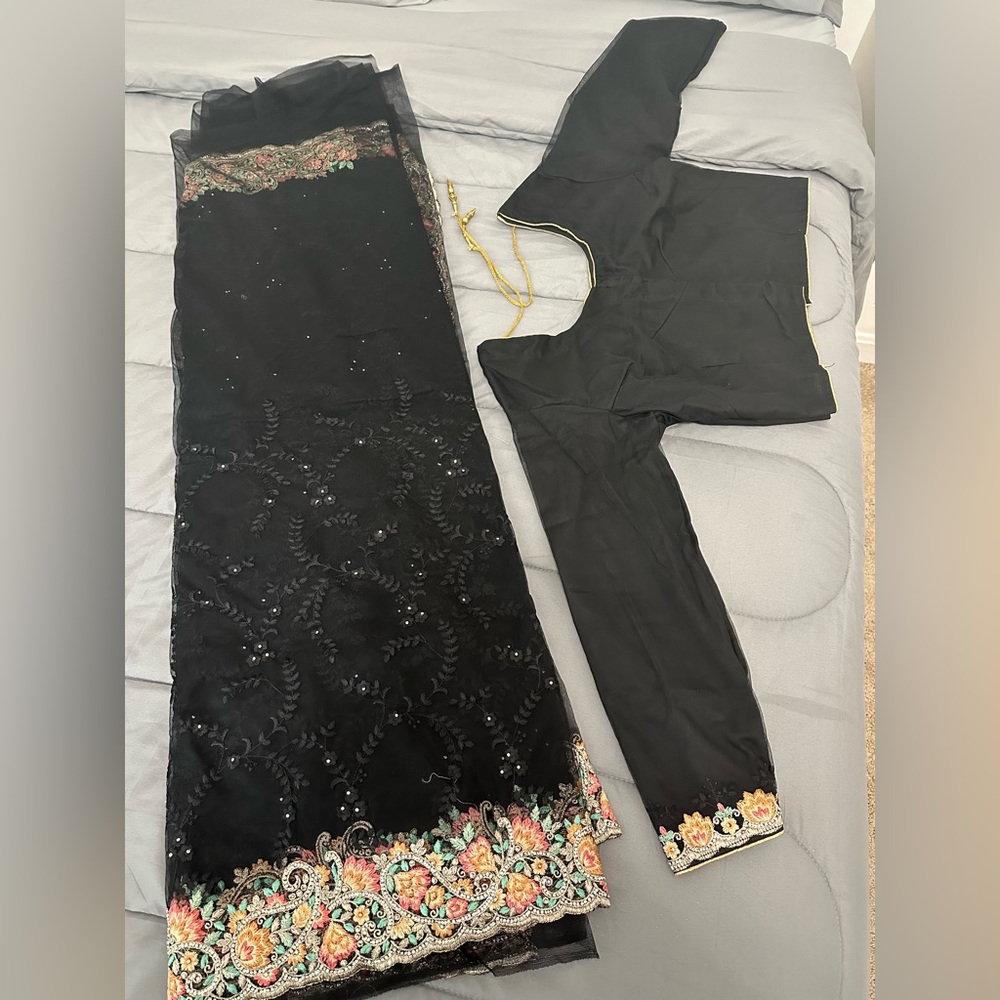 Black lace net saree with floral thread work embroidery including blouse.